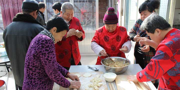 Family making dumpling together
